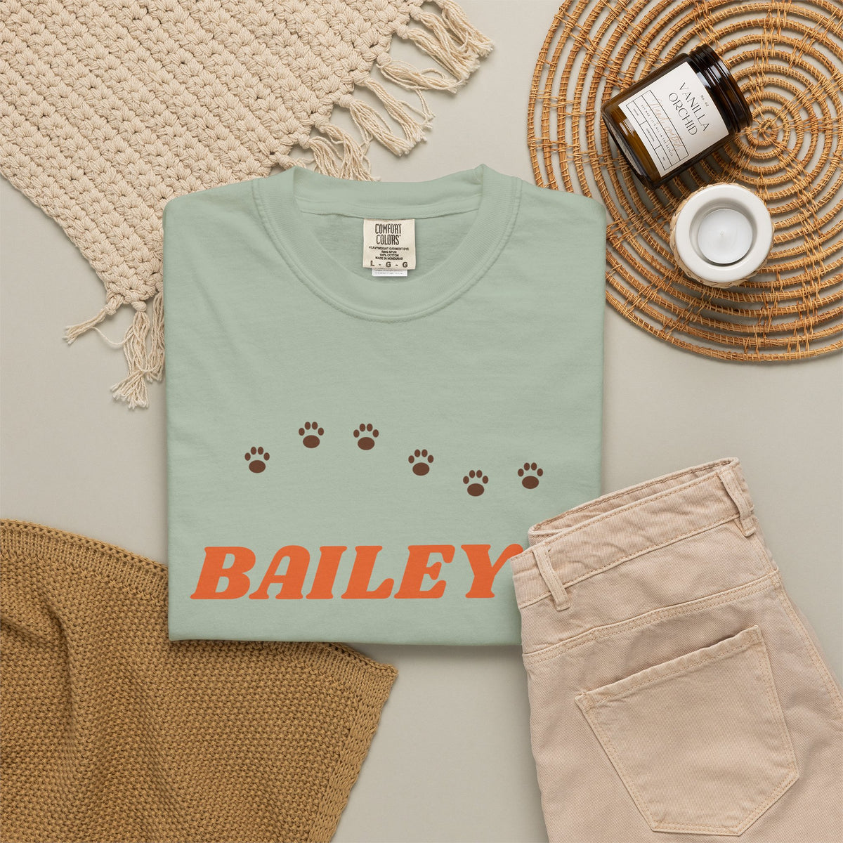 Tee printed with BAILEY'S in orange retro letters over FAVORITE HUMAN with a brown paw print trail, view 12